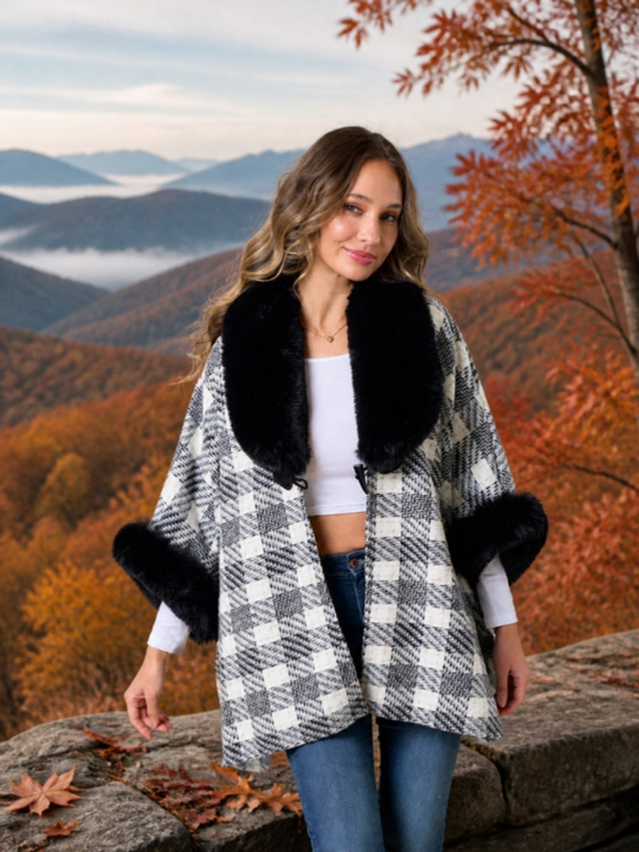Shop Sweaters - woman in a White Lotus plaid cape at a mountain overlook